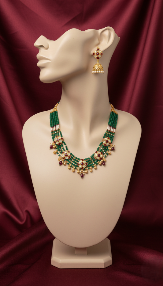 Royal Gold Plated Multi-Strand Emerald Green Bead Necklace with Kundan Motifs and Matching Jhumka Earrings